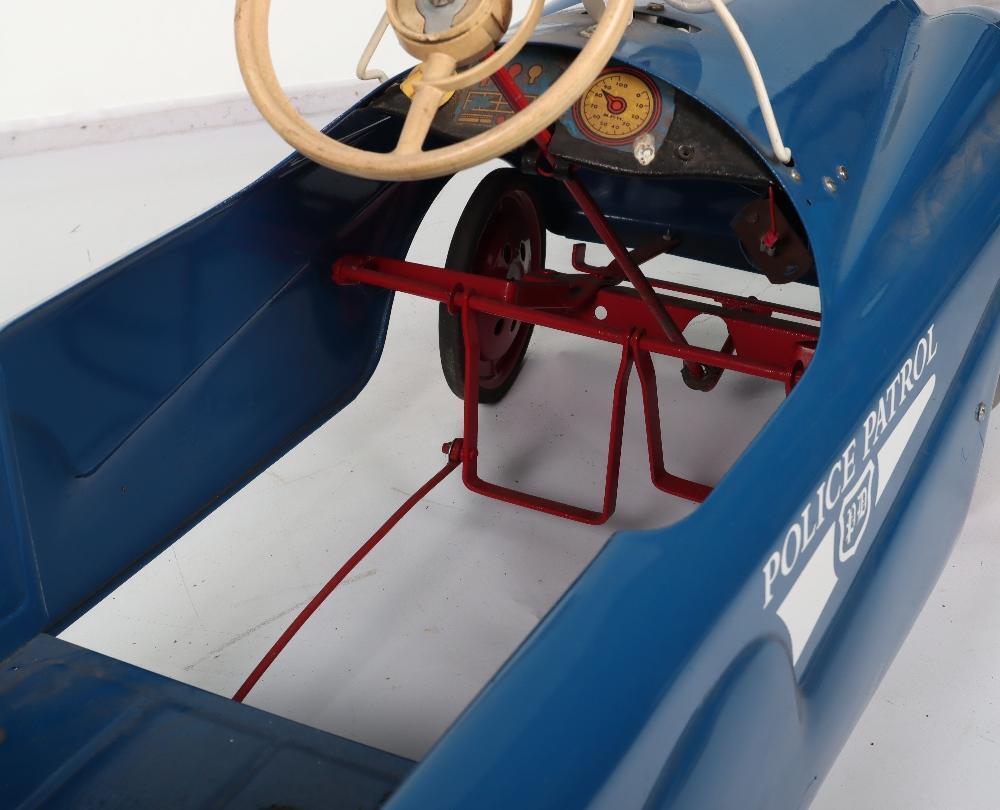A Mobo pressed steel Police Patrol child’s pedal car, English 1960s
