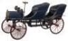 A fine and early wooden and metal vintage tandem child’s chain driven pedal car, European circa 1910
