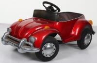 A pressed steel child’s VW Beetle pedal car, probably English circa 1970