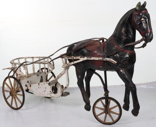 A very rare and early French pressed steel child’s pedal horse and trap, circa 1900