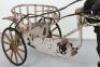 A very rare and early French pressed steel child’s pedal horse and trap, circa 1900 - 3