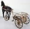 A very rare and early French pressed steel child’s pedal horse and trap, circa 1900 - 7