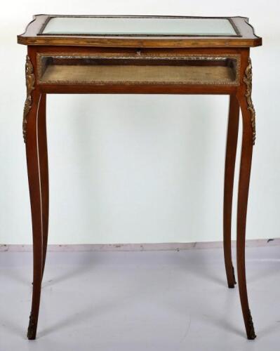 A French mahogany serpentine Bijouterie table in Louis XV style