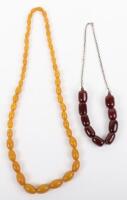 A cherry amber bead necklace on silver chain