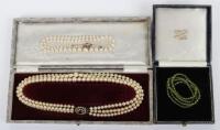 A single row cultured pearl necklace with diamond and 9ct (unmarked) clasp