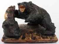 A Japanese carved wood group of bear and cub with salmon
