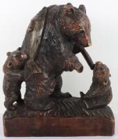 A Japanese wood carved group of bear and two cubs