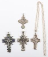 Four Russian silver and metal cross pendants