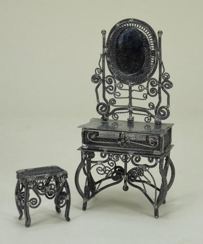 An unusual spun metal dressing table and stool,