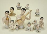 Collection of glazed china Pierrot half dolls,