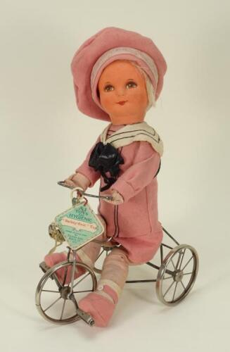 A rare Dean’s rag Book A1 Doll (Buster Brown) on Trike cloth doll, circa 1930,