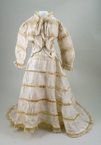 A cream silk dress for large French fashion doll, 1890s,