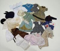 A collection of dolls clothes,