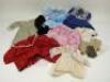 A collection of doll and children’s clothing,