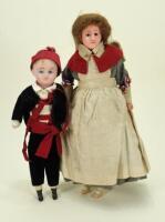 A poured wax shoulder head doll in French Nurses uniform, German circa 1900,