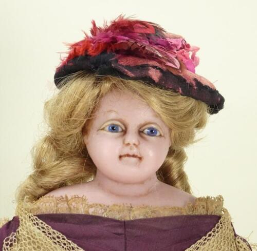 A Montanari poured wax shoulder head doll, English circa 1860