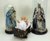 A pair of wax Madonna figures in glass domes, southern European 20th century,