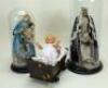 A pair of wax Madonna figures in glass domes, southern European 20th century,