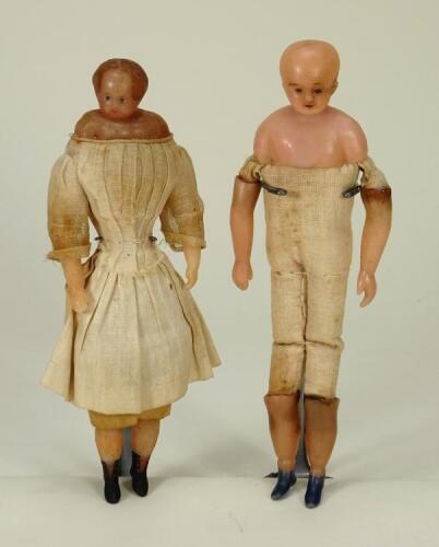 Two Early bees wax shoulder head dolls, English circa 1850,