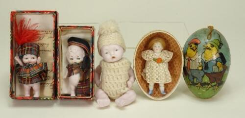 Two miniature boxed all bisque dolls in Scottish clothes, 1940s,