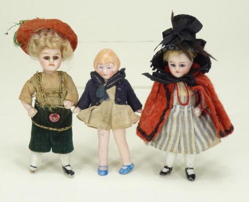 A pair of miniature all bisque dolls house dolls, German circa 1910,