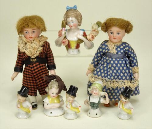 A pair of miniature all bisque dolls house dolls, German 1920s,