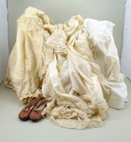 Collection of christening gowns and capes,