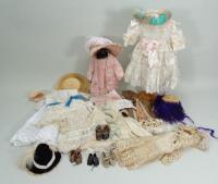 Collection of various dolls dresses, bonnets and shoes,