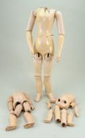 Three wood and composition dolls bodies,