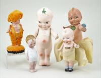 Collection of five various Kewpie type dolls,