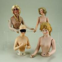 Four larger size bisque nude half-dolls,