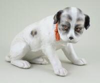 Large Gebruder Heubach seated dog figurines, German circa 1910,