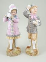 Pair of Gebruder Heubach figurines in winter theme, German circa 1910,