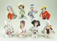 Eight glazed china half-dolls,