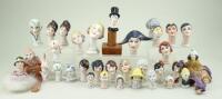 Collection of glazed china heads, 1920s,