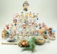 Collection of pin-cushion figures, 1920s/30s,