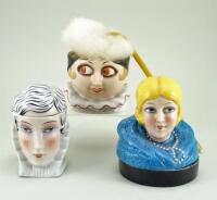 Two glazed china dressing table box heads and a powder puff head, 1920s,