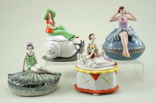 Four glazed china Deco Lady dressing table boxes, 1920s,