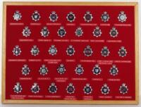 Collection of Thirty Three Obsolete Police Blue Ring Cap Badges