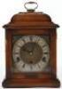 An Elliott of London oak cased Georgian style mantel clock