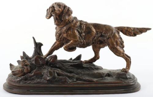 A gilt bronze group of a hunting dog and duck