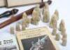 A mixed lot, including a Lewis chessmen set, a desk cannon - 3