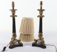 A pair of French gilt and patinated metal candlestick table lamps in Louis Philippe taste