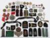 A mixed lot of WWII badges, cloth insignia, some reproduction