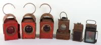 A selection of vintage petrol cans and Greenham lamps