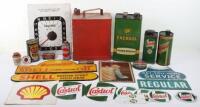 Selection of vintage oil cans and signs