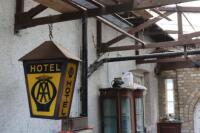 An AA (Automobile Association) hotel hanging light sign