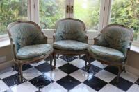 A set of three Louis XVI style giltwood chairs