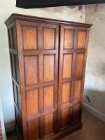 An Arts & Crafts oak armoire