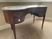 An Edwardian kidney kneehole desk